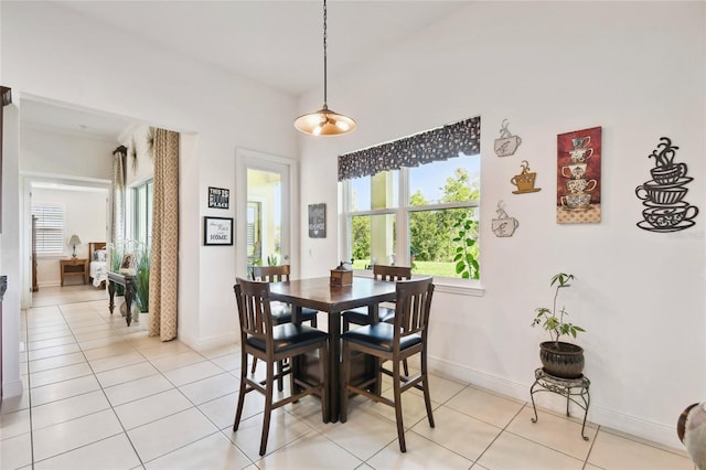 dining room featuring light tile floors