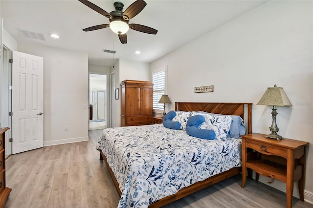 bedroom with ceiling fan and light hardwood / wood-style flooring