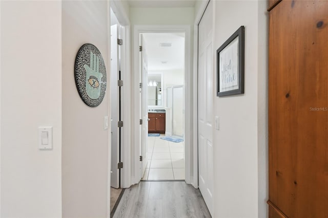 hallway featuring light hardwood / wood-style flooring