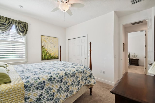 bedroom with light carpet, a closet, and ceiling fan