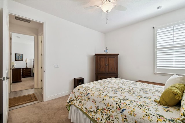 bedroom featuring ceiling fan and light colored carpet