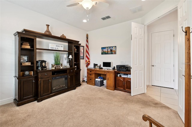 home office with ceiling fan and light colored carpet