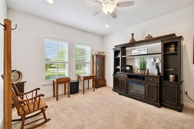 sitting room with light carpet and ceiling fan