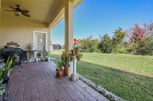 view of patio / terrace with area for grilling and ceiling fan