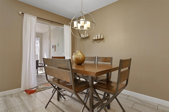 dining area featuring a notable chandelier and light tile patterned floors