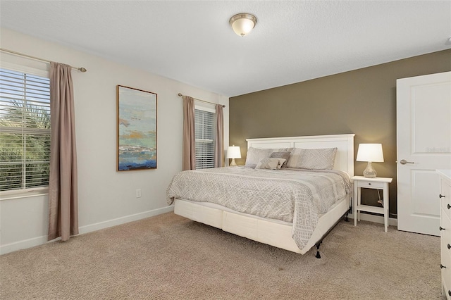 bedroom featuring light colored carpet