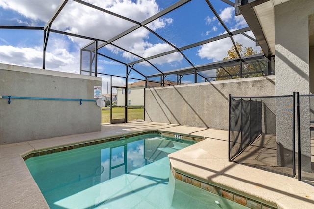 view of swimming pool with a lanai and a patio