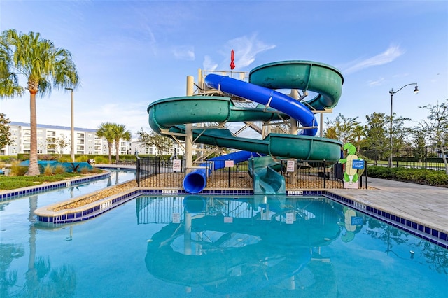 view of pool with a water slide