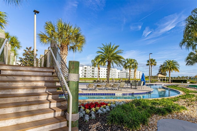 exterior space featuring a swimming pool and a patio area