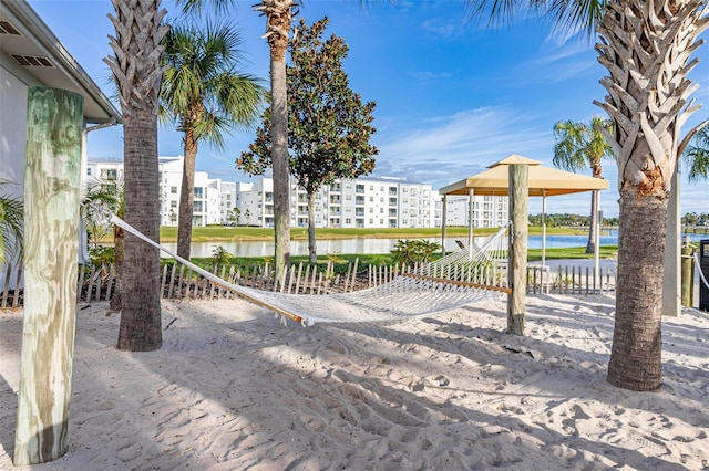 view of patio / terrace with a gazebo and a water view