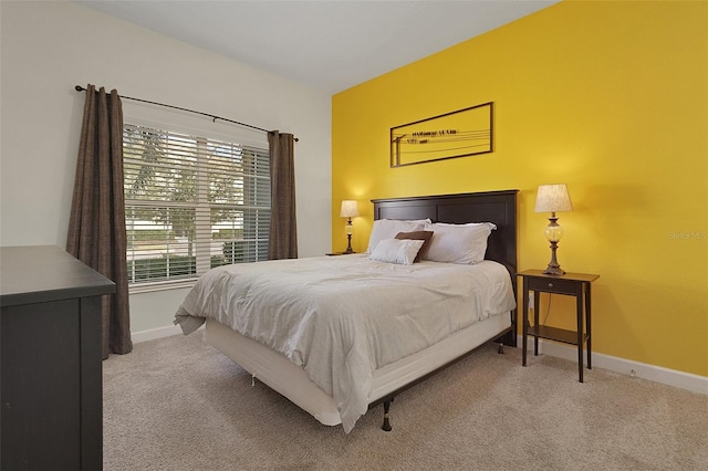 bedroom with light colored carpet