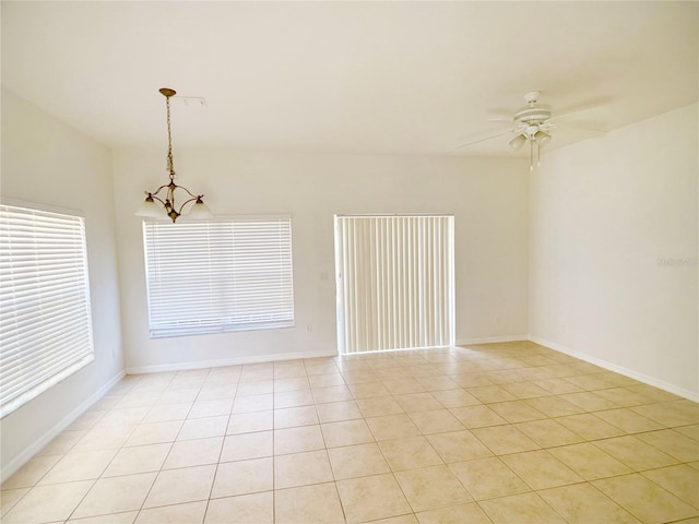 empty room featuring light tile flooring and ceiling fan