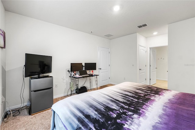 bedroom featuring light colored carpet