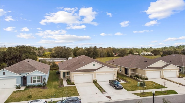 view of front of home featuring a front yard and a garage