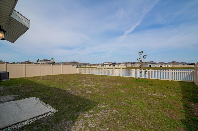 view of yard featuring central air condition unit