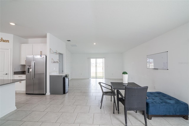 dining space with light tile floors