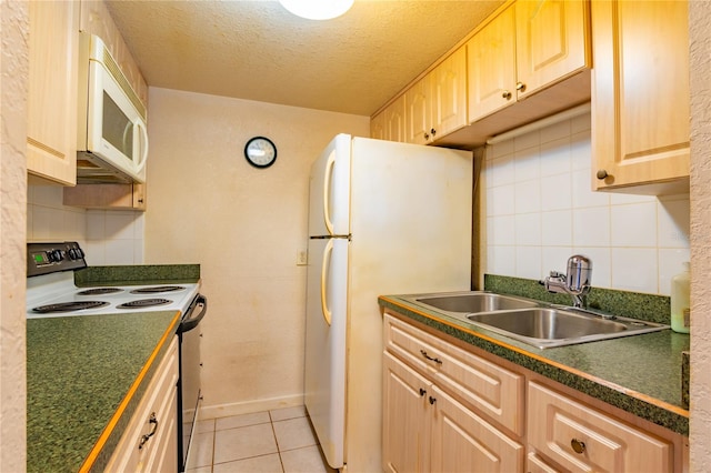 kitchen featuring white appliances, sink, light tile floors, a textured ceiling, and tasteful backsplash