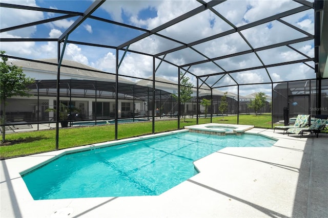 view of swimming pool with a yard, a patio area, an in ground hot tub, and a lanai