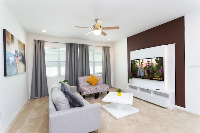 carpeted living room featuring ceiling fan