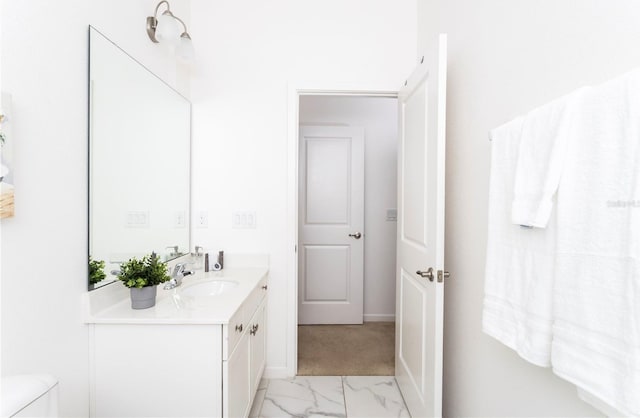 bathroom featuring vanity, tile flooring, and toilet