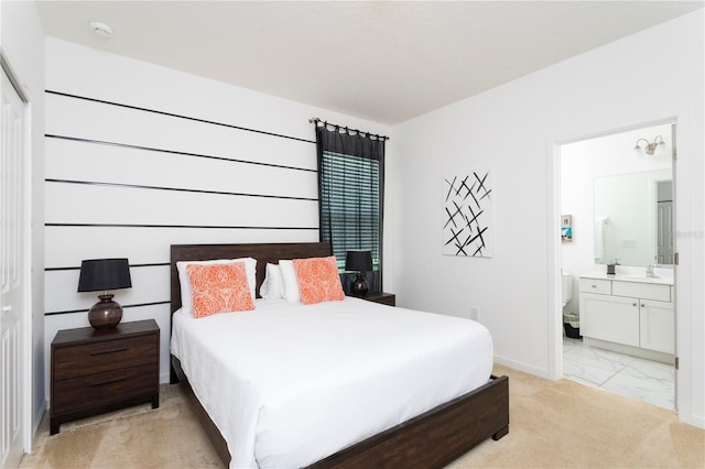 carpeted bedroom with ensuite bathroom