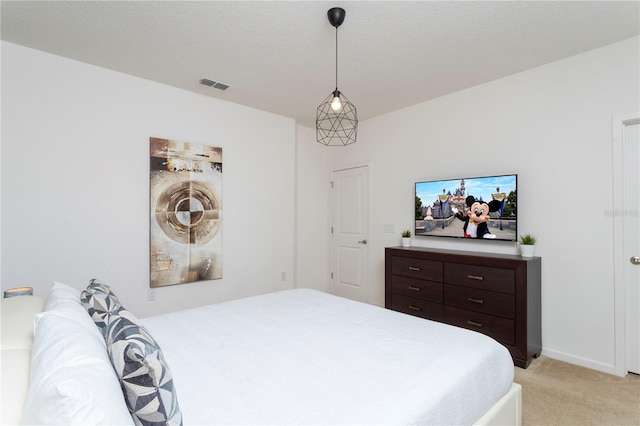 bedroom featuring light colored carpet