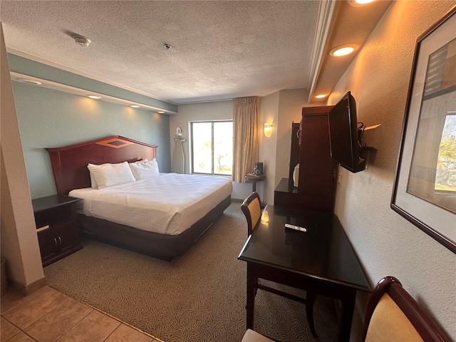 tiled bedroom featuring a textured ceiling