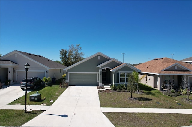 view of front of property featuring a front lawn and a garage