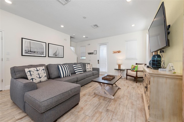 living room with light hardwood / wood-style floors