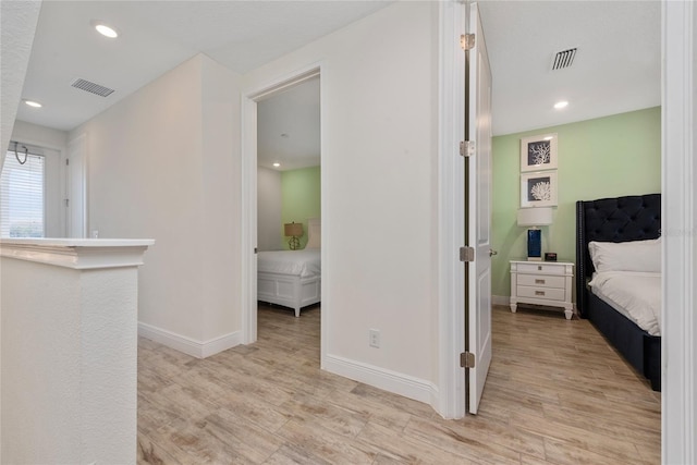 corridor featuring light hardwood / wood-style flooring