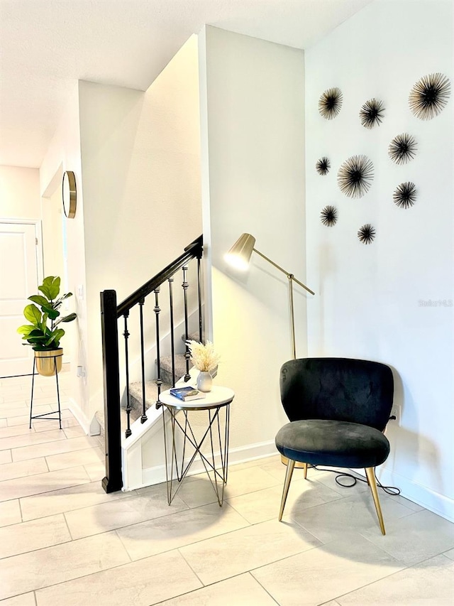 living area featuring light tile floors