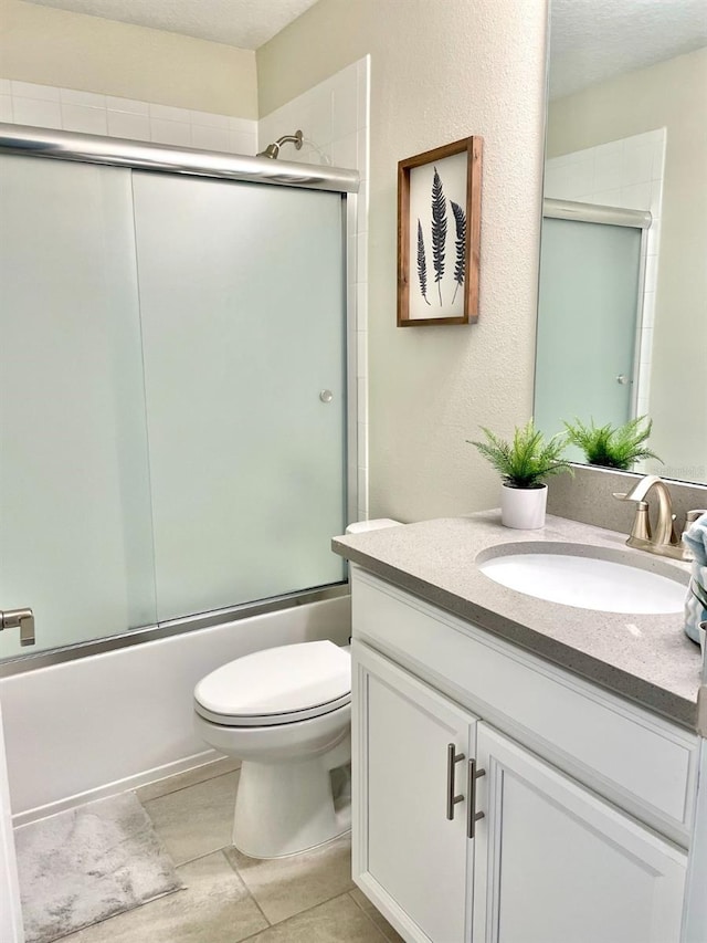 full bathroom with enclosed tub / shower combo, tile flooring, vanity, and toilet