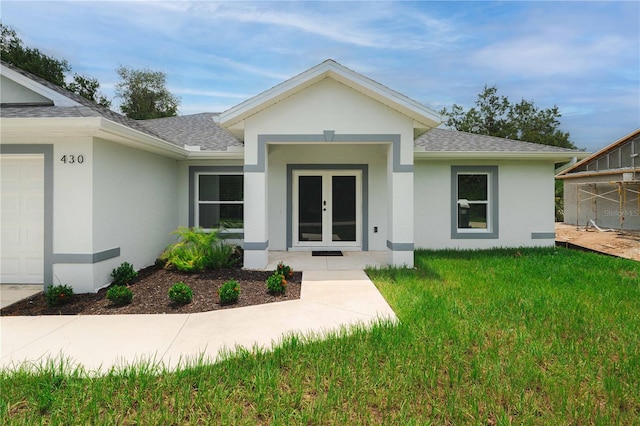 exterior space featuring a garage and a yard