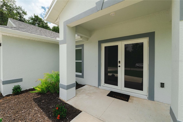 entrance to property featuring a patio and french doors