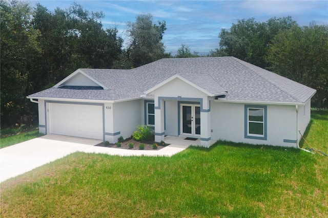 ranch-style house with a garage and a front yard