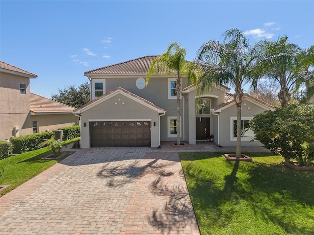 mediterranean / spanish-style house with central AC unit and a front lawn