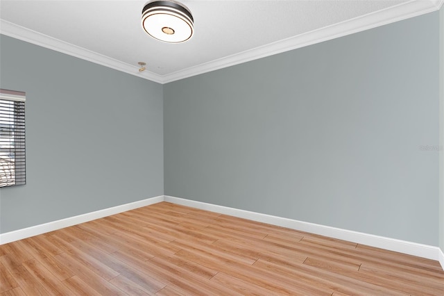 unfurnished room with hardwood / wood-style flooring and ornamental molding