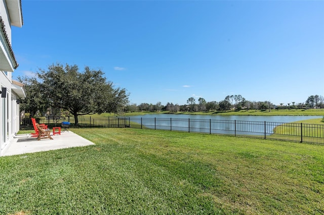 view of yard featuring a water view and a patio area