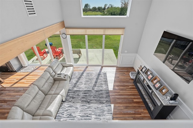 living room with dark hardwood / wood-style flooring