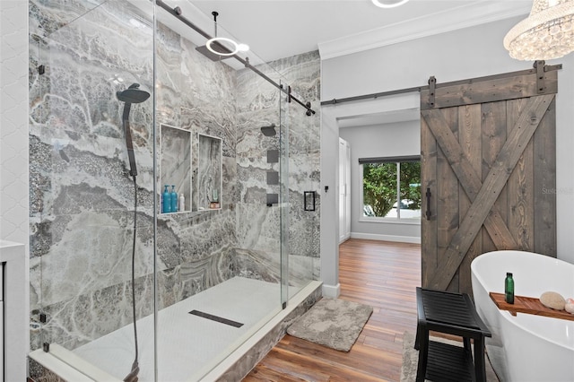 bathroom with independent shower and bath, crown molding, and hardwood / wood-style floors