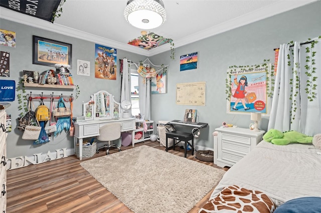 bedroom with hardwood / wood-style flooring and ornamental molding