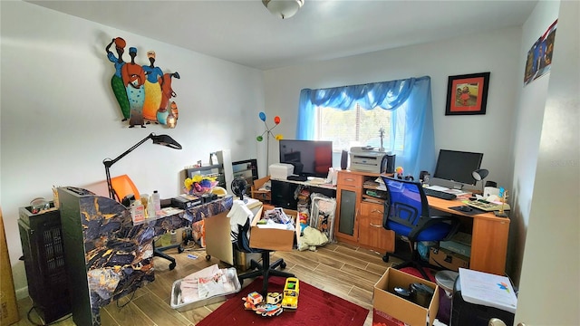 office with light wood-type flooring