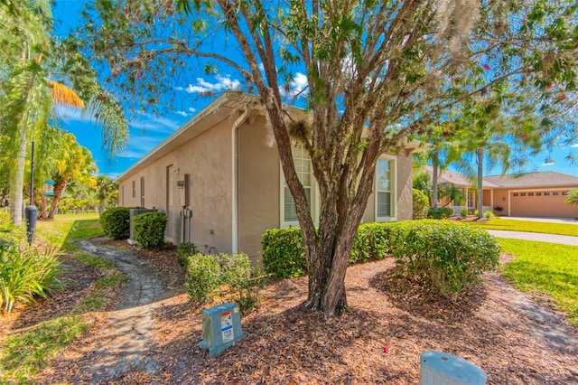 view of property exterior with a garage