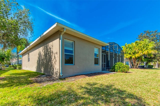 view of property exterior featuring a lanai and a yard