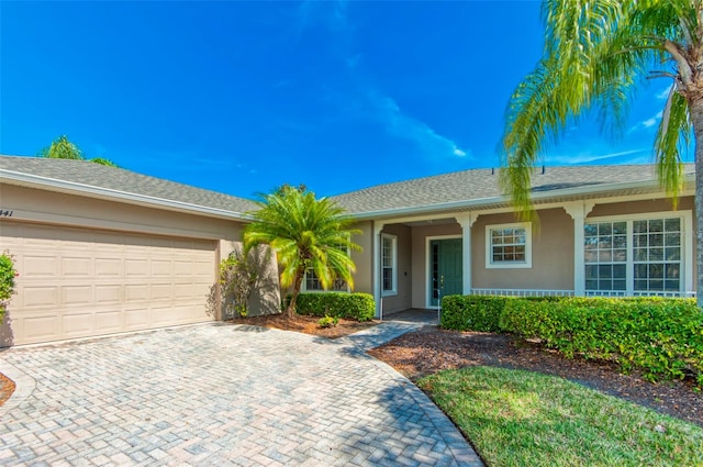 single story home with a garage