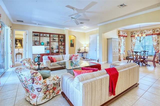 living room featuring light tile floors, crown molding, and ceiling fan