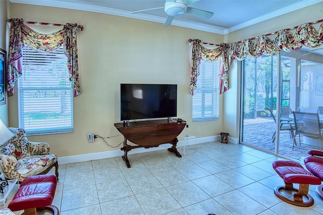 living room with light tile floors, crown molding, and ceiling fan