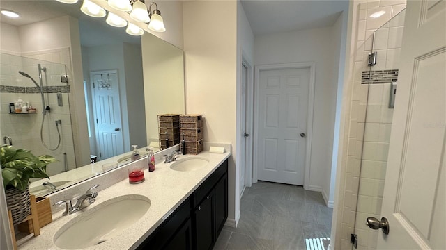 bathroom featuring walk in shower, tile floors, and double vanity