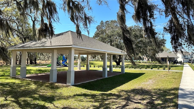 view of property's community featuring a gazebo, a yard, and a playground