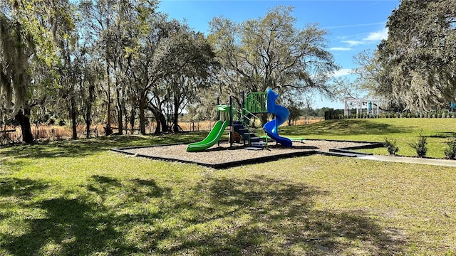 view of playground featuring a lawn